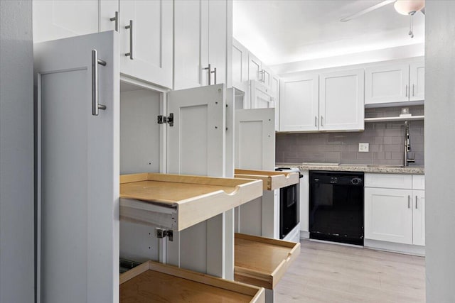 1521 NW 19th Ter Unit 101, Delray Beach, FL 33445 - kitchen featuring black dishwasher, white cabinetry, decorative backsplash, and a sink