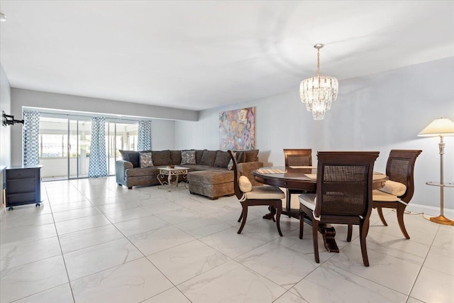 1521 NW 19th Ter Unit 101, Delray Beach, FL 33445 - dining room featuring a chandelier and light marble finish floors
