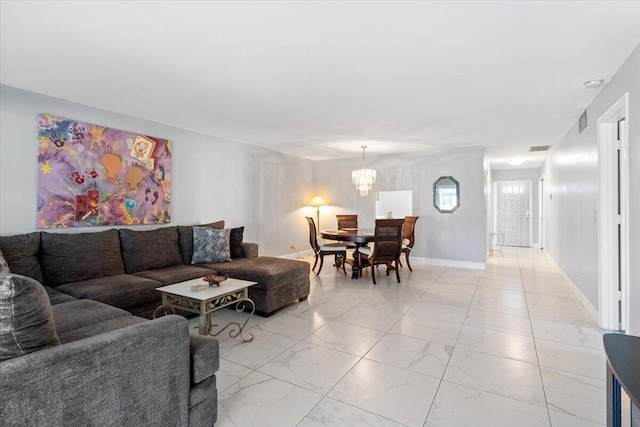 1521 NW 19th Ter Unit 101, Delray Beach, FL 33445 - living room with light marble finish flooring, a chandelier, and baseboards