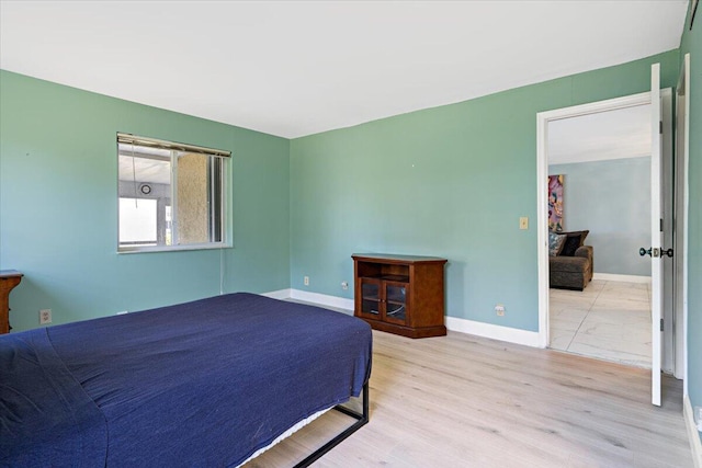 1521 NW 19th Ter Unit 101, Delray Beach, FL 33445 - bedroom featuring wood finished floors and baseboards