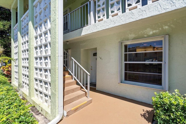 1521 NW 19th Ter Unit 101, Delray Beach, FL 33445 - doorway to property featuring stucco siding
