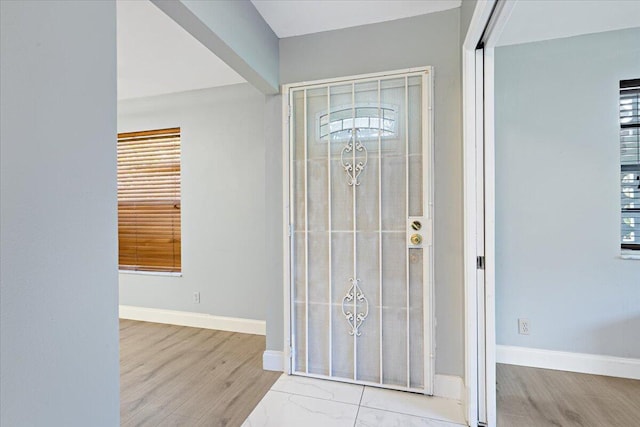1521 NW 19th Ter Unit 101, Delray Beach, FL 33445 - foyer entrance featuring baseboards and wood finished floors
