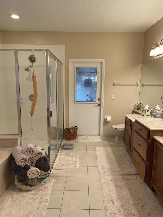 17768 Temple Blvd, Loxahatchee, FL 33470 - bathroom featuring vanity, tile patterned floors, a stall shower, toilet, and recessed lighting
