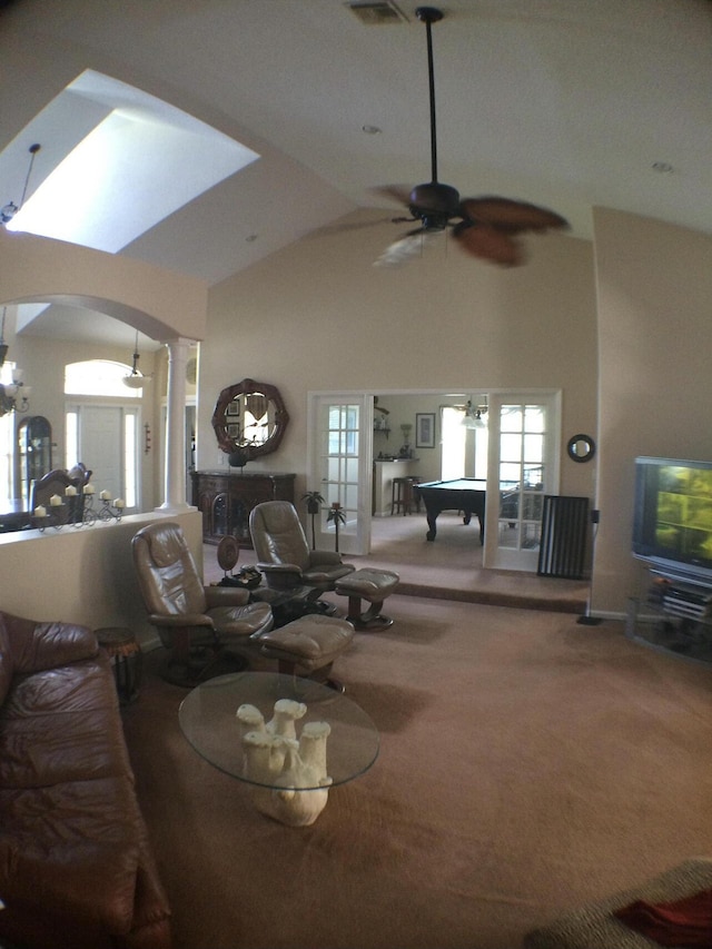 17768 Temple Blvd, Loxahatchee, FL 33470 - carpeted living room with decorative columns, arched walkways, ceiling fan, plenty of natural light, and high vaulted ceiling