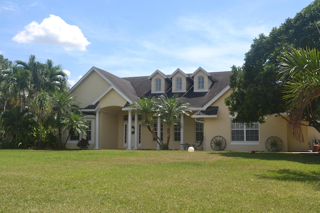 17768 Temple Blvd, Loxahatchee, FL 33470 - view of front of house featuring stucco siding and a front yard