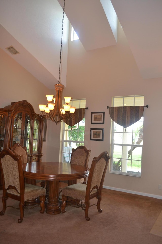 17768 Temple Blvd, Loxahatchee, FL 33470 - carpeted dining room with a chandelier, high vaulted ceiling, and baseboards