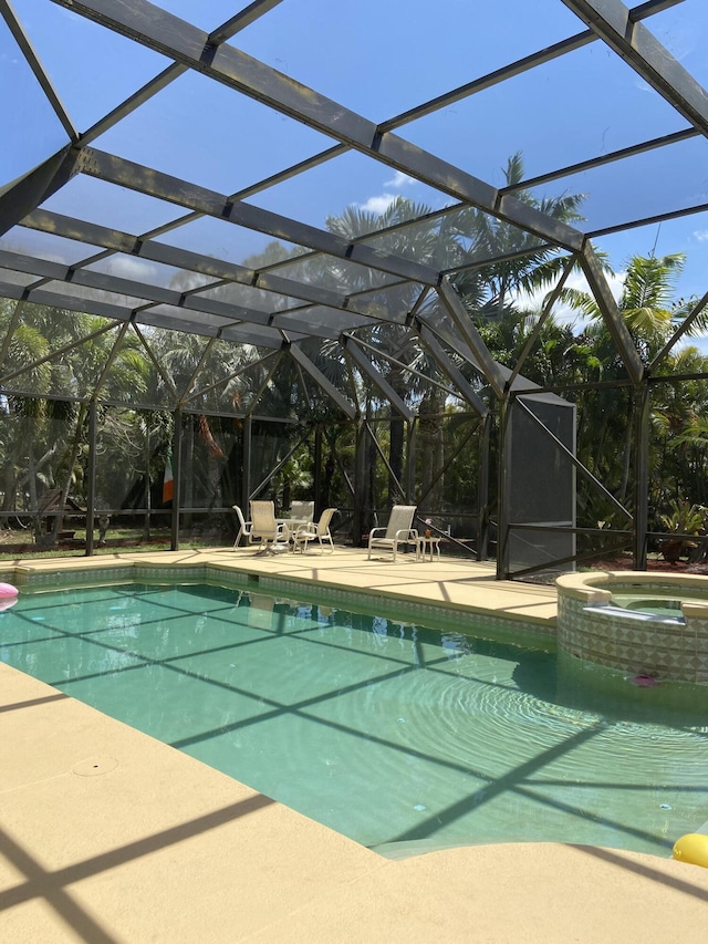 17768 Temple Blvd, Loxahatchee, FL 33470 - view of pool with glass enclosure, a patio, and a pool with connected hot tub