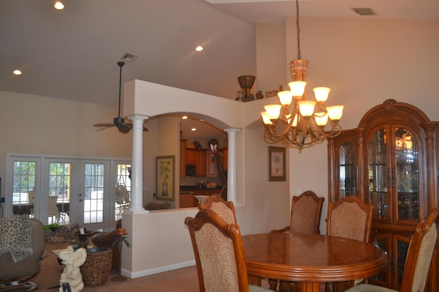 17768 Temple Blvd, Loxahatchee, FL 33470 - dining room with decorative columns, a chandelier, arched walkways, high vaulted ceiling, and recessed lighting