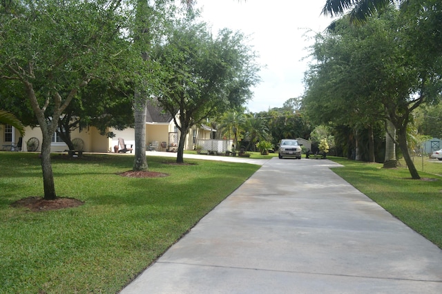 17768 Temple Blvd, Loxahatchee, FL 33470 - view of community featuring driveway and a yard