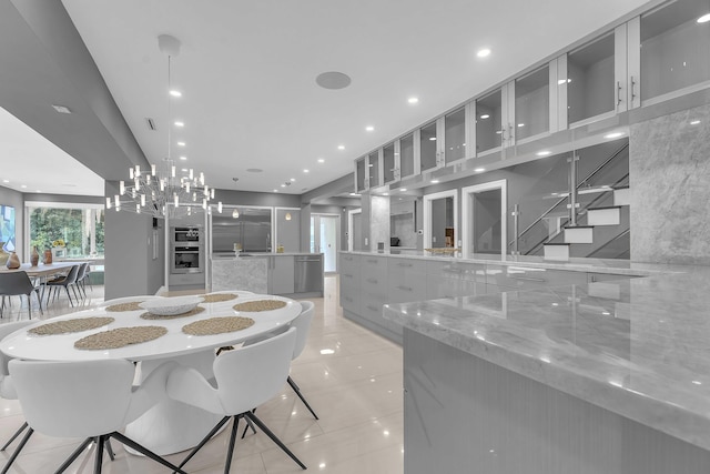 dining space with recessed lighting and light tile patterned floors