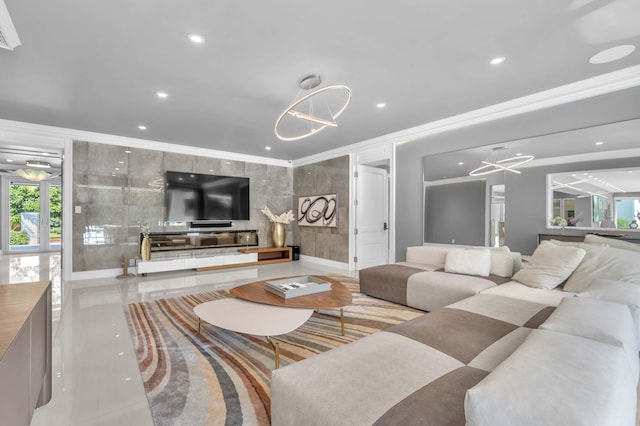 living room featuring baseboards, recessed lighting, a notable chandelier, and ornamental molding