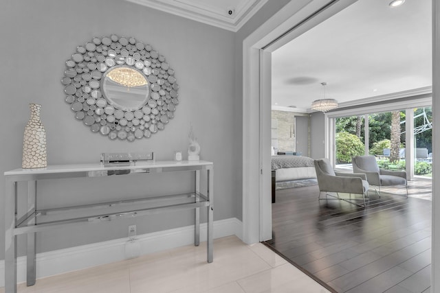 interior space with tile patterned flooring, crown molding, and baseboards