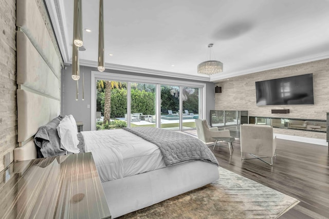 bedroom featuring wood finished floors, access to outside, and ornamental molding