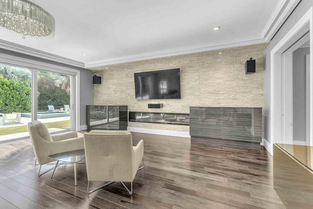 dining area featuring ornamental molding, wood finished floors, and recessed lighting