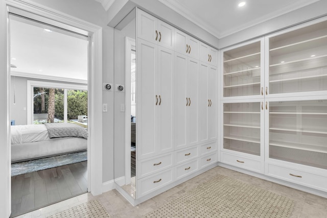 mudroom featuring baseboards, recessed lighting, and ornamental molding