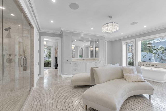 full bathroom featuring a shower stall, vanity, an inviting chandelier, a freestanding bath, and ornamental molding