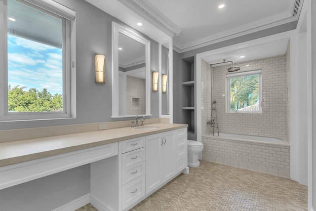 bathroom featuring tiled shower / bath, toilet, vanity, ornamental molding, and built in features