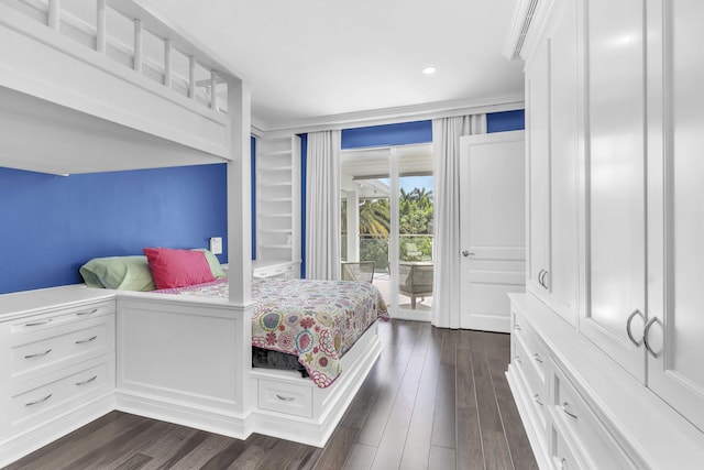 bedroom with access to exterior, dark wood-type flooring, and recessed lighting