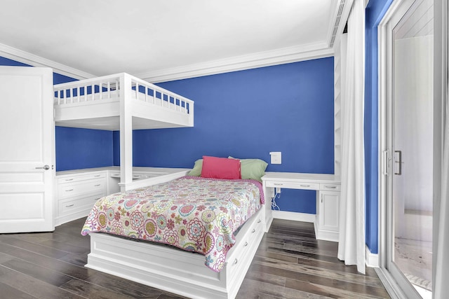 bedroom with dark wood-style flooring, ornamental molding, and baseboards
