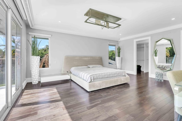 bedroom featuring crown molding and multiple windows