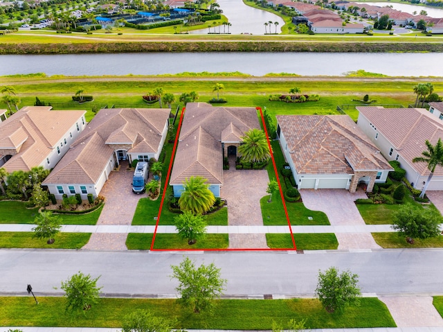 aerial view with a residential view and a water view