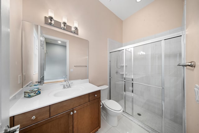 full bathroom featuring toilet, a stall shower, tile patterned flooring, and vanity