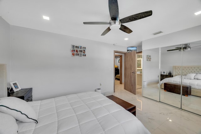 bedroom with recessed lighting, marble finish floor, visible vents, a ceiling fan, and a closet