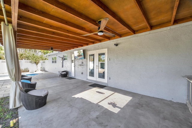 view of patio / terrace featuring french doors, a fenced backyard, and ceiling fan