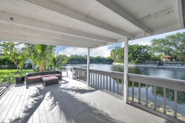 wooden deck with a water view