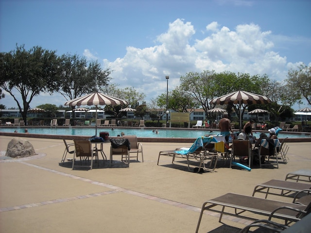 community pool with a patio