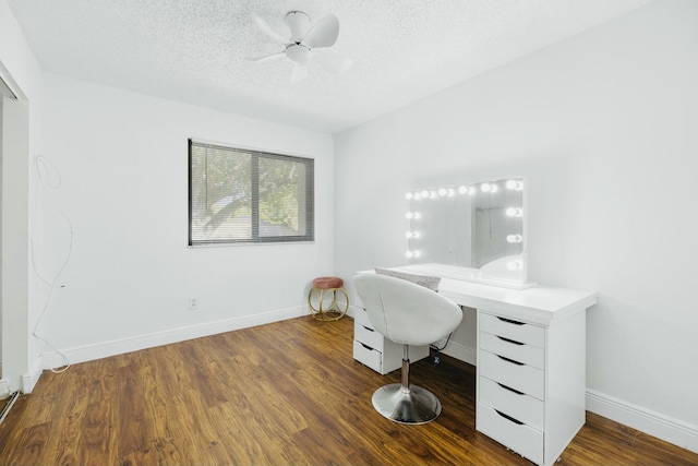 office featuring wood finished floors, a textured ceiling, a ceiling fan, and baseboards