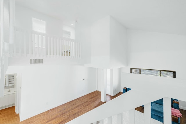 stairs with recessed lighting, wood finished floors, visible vents, and baseboards