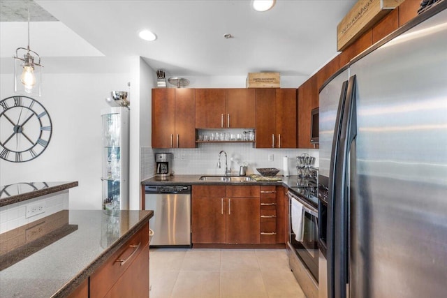 300 S Australian Ave Unit 717, West Palm Beach, FL 33401 - kitchen with appliances with stainless steel finishes, light tile patterned floors, tasteful backsplash, dark stone counters, and open shelves