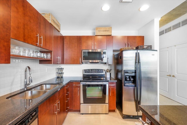 300 S Australian Ave Unit 717, West Palm Beach, FL 33401 - kitchen with stainless steel appliances, backsplash, dark stone counters, recessed lighting, and open shelves