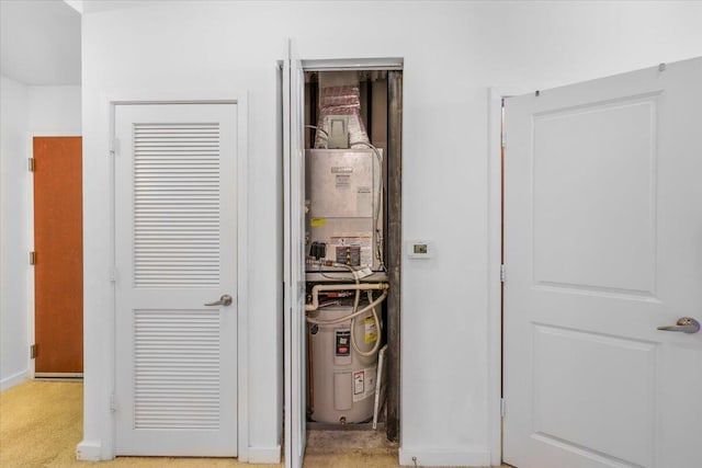 300 S Australian Ave Unit 717, West Palm Beach, FL 33401 - utility room featuring electric water heater