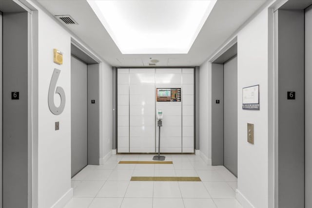 300 S Australian Ave Unit 717, West Palm Beach, FL 33401 - corridor featuring elevator and light tile patterned floors