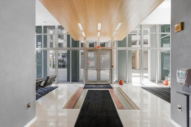 300 S Australian Ave Unit 717, West Palm Beach, FL 33401 - lobby with expansive windows, wooden ceiling, and a high ceiling