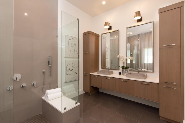 full bath with walk in shower, tile patterned floors, and vanity