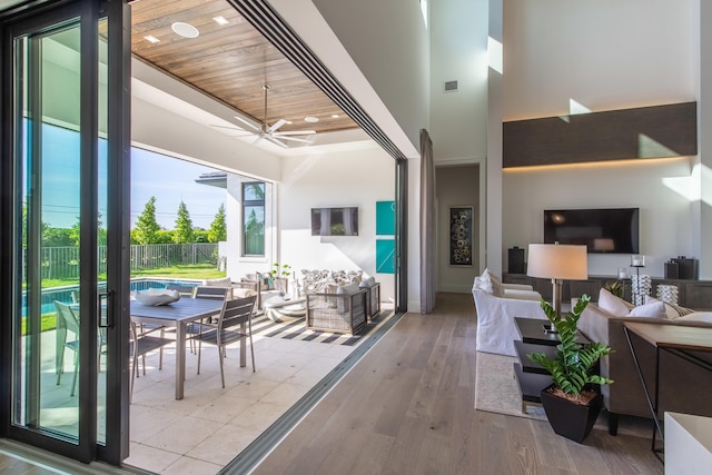 interior space featuring a fenced in pool, visible vents, fence, a ceiling fan, and an outdoor hangout area