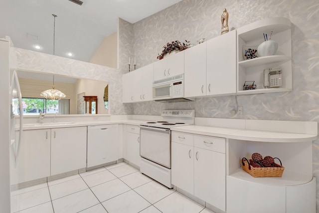 kitchen featuring white appliances, wallpapered walls, open shelves, light countertops, and a sink