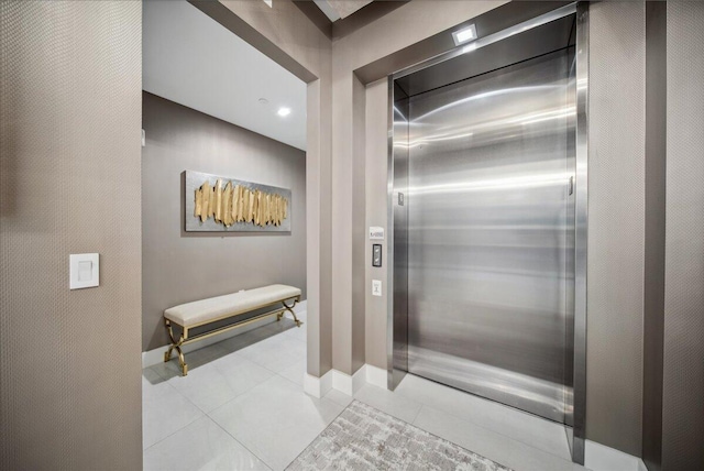 5000 N Ocean Dr Unit 603, Singer Island, FL 33404 - bathroom featuring elevator, tile patterned flooring, and baseboards