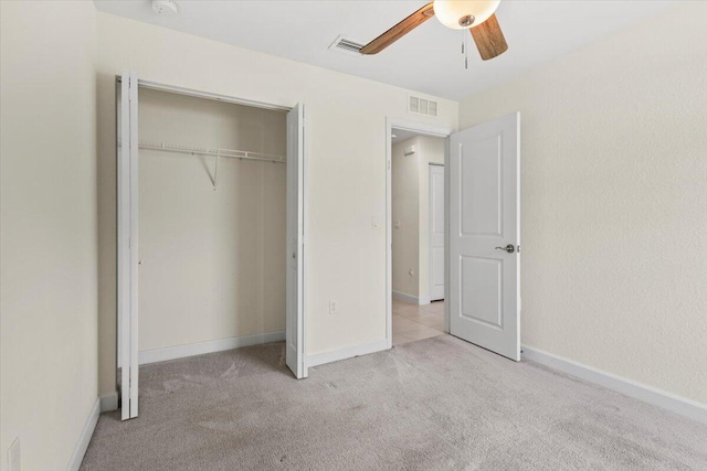 unfurnished bedroom with carpet flooring, a closet, ceiling fan, and baseboards