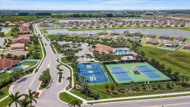 aerial view of residential area with a large body of water