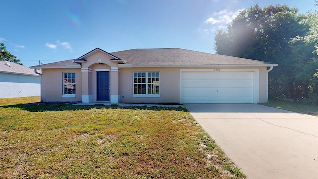 single story home featuring stucco siding, driveway, a front yard, and a garage