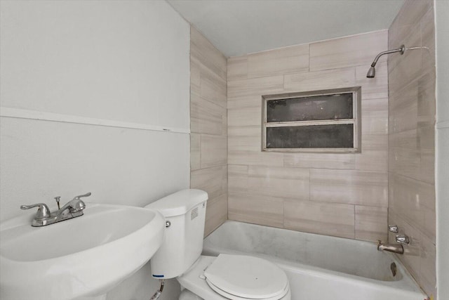 full bathroom with shower / bathing tub combination, a sink, and toilet