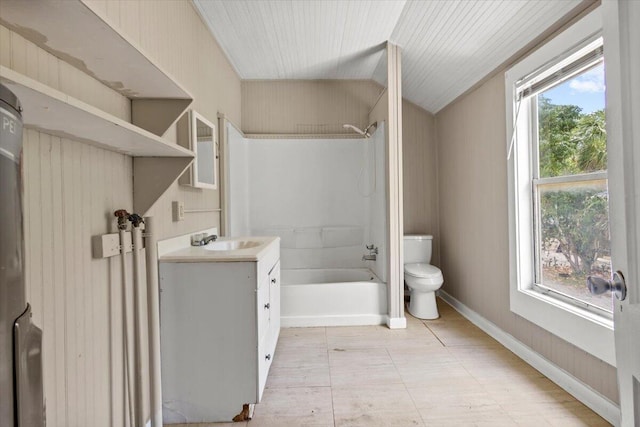 bathroom with toilet, vanity, bathtub / shower combination, and baseboards