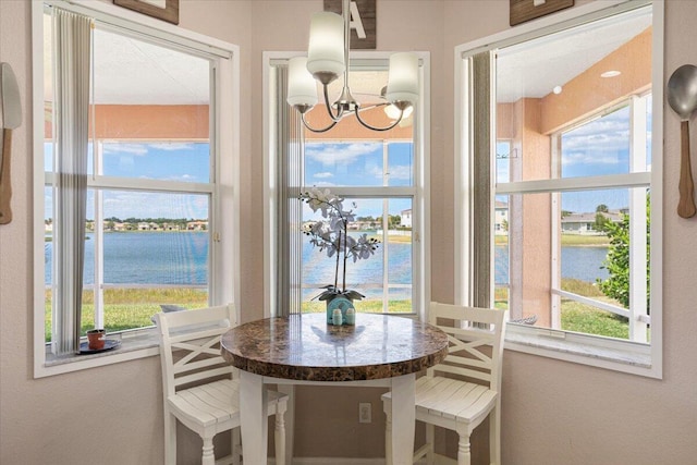 1018 NW Demedici Rd, Port Saint Lucie, FL 34986 - dining area with a water view and a chandelier