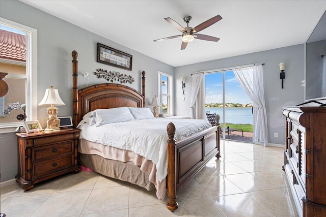 1018 NW Demedici Rd, Port Saint Lucie, FL 34986 - bedroom featuring access to outside, light tile patterned floors, baseboards, and ceiling fan
