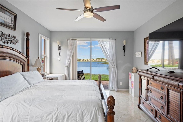 1018 NW Demedici Rd, Port Saint Lucie, FL 34986 - bedroom with access to outside, ceiling fan, light tile patterned floors, and baseboards