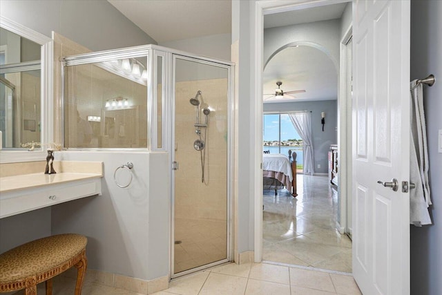 1018 NW Demedici Rd, Port Saint Lucie, FL 34986 - full bathroom with a shower stall, ceiling fan, tile patterned flooring, and baseboards
